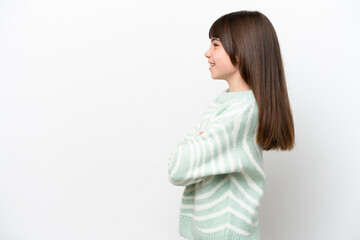 Little caucasian girl isolated on white background in lateral position