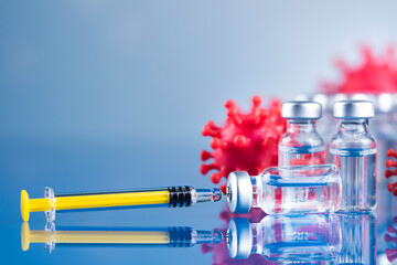 Close up medical syringe with a vaccine - 579756238