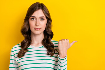 Closeup portrait of confident business serious lady wear striped white pullover point finger mockup new startup isolated on yellow color background
