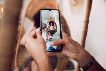 Hands, phone and fashion with a designer taking a photograph of a model black woman in a swing...