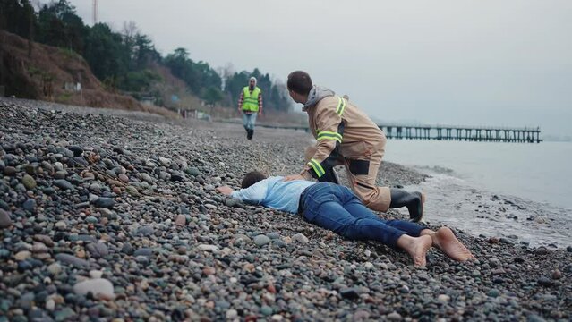 uniformed lifeguard finds missing person on drowned beach