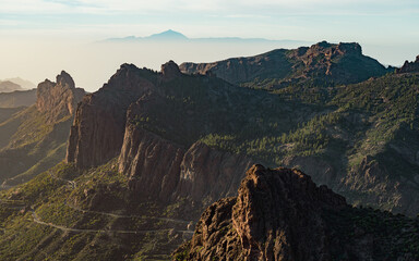 View of Mountains and Dramatic Rocky Mountains with Tenerife in the Background in Gran Canaria, Spain