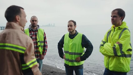 a group of volunteers searching for a missing person briefing on the ocean