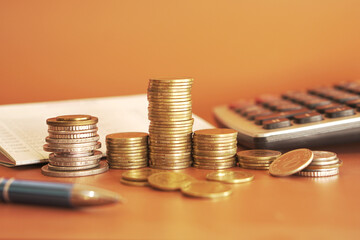 stacks of money coin with calculator, Business and financial investment concept
