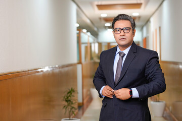 Fototapeta premium Indian businessman wearing suit and giving expression.