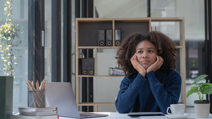 African American businesswomen working in an office, young businesswomen stressed from work...