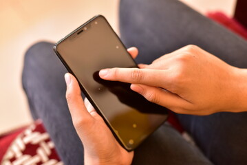 Person using internet on mobile for communication