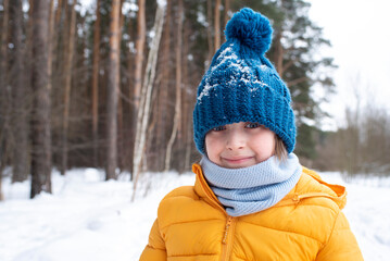 Fototapeta na wymiar portrait of a smiling boy in warm clothes 