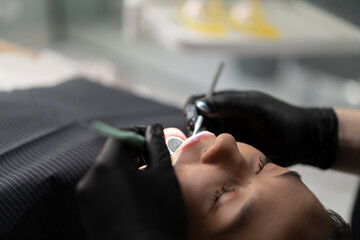 Dentistry a dentist examines a patient's teeth