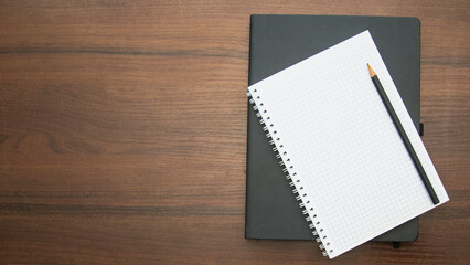 Notebook and pencil on a beautiful background in a photo studio