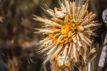 Traditional Lithuanian Easter palm made of dried flowers, ears of wheat, willow, birch,...
