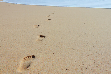 Print of foot steps on wet sand