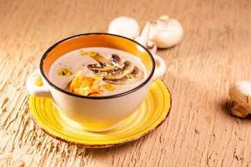 mushroom soup in a plate on the table in a restaurant