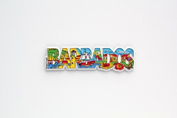 Colourful PVC souvenir fridge magnet of Barbados on white background. Travel memory concept. Gift typical product for tourists from foreign trip. Home decoration. Top view, flat lay, close up