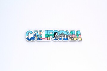 Colourful PVC souvenir fridge magnet of California, USA on white background. Travel memory concept....