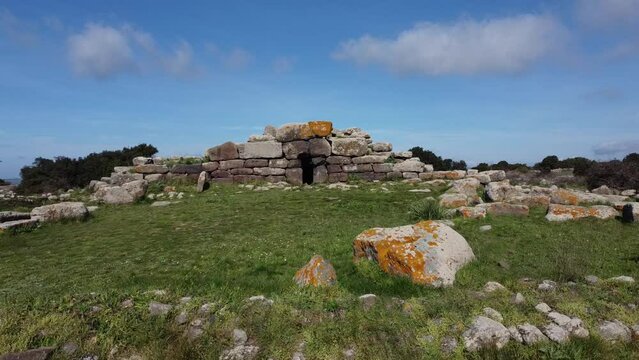 Archeological ruins of Nuragic necropolis Giants Tomb of S&rsquo;omu de S&rsquo;orcu - Tomba di Giganti Omu de Orcu - with front grave stones of Neolithic cemetery
