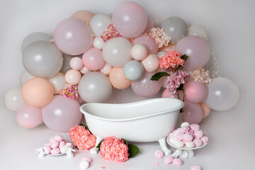 Obraz na płótnie Canvas baby milk bath. first birthday. garland of balls, decor decoration for the holiday. marshmallow