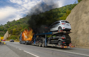 The truck transporting cars caught fire on the way. Fire caused by an electrical short circuit in...