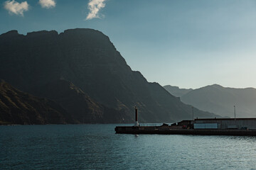 View of rocky high cliffs and port in Puerto de las Nieves, Agaete, in northern coast of Gran Canaria, Spain