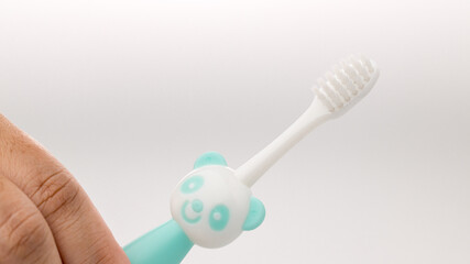 Toothbrush of baby health care. Toothbrush for young baby. 