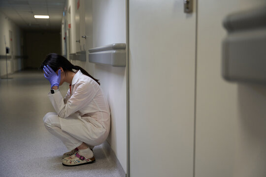 Sad woman doctor is feeling tired in the hospital