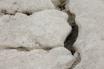 stone in the sand with cracks