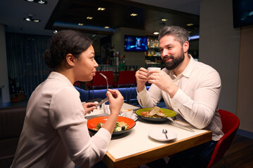 Man in love having dinner with his girlfriend