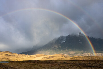 Fototapeta na wymiar Rainbow over Torres del Paine National Park, Chile, South America