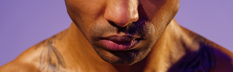 Close up of man doing exercise with weight dumbbells on studio background. Strength and motivation