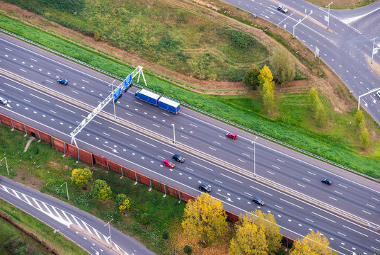 Aerial view of motorway A28 with cars, truck and noise barrier, Amersfoort, province of Utrecht, The Netherlands.