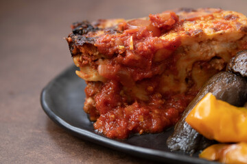 Italian Traditional food, Lasagna, on black background