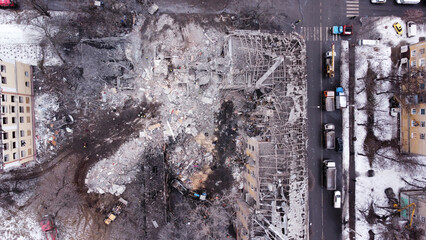 Kiev, Ukraine - 08 March 2023: Aerial view of bombed residential building with snow in winter during the war between Russia and Ukraine.