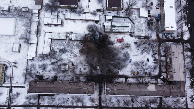 Kiev, Ukraine - 08 March 2023: Aerial view of bombed residential building with snow in winter during the war between Russia and Ukraine.