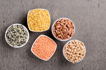 Top view of Raw pulses and legume in bowl on table