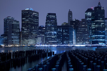 Lower Manhattan skyline night view from Brooklyn Bridge Park in New York City.	