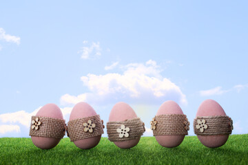 easter eggs in grass on sky background