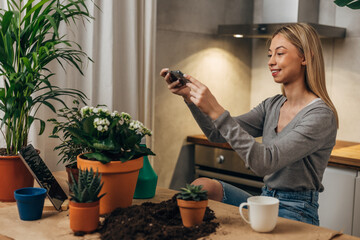 A woman photographs plants for her business