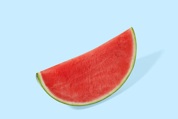 Cut watermelon on blue pastel background