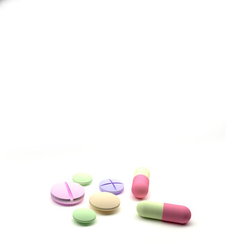 Pills and capsules scattered on white background. 3d render illustration Multicolored pills and tablets. Tablets background with drugs pills. 3d render medical background.