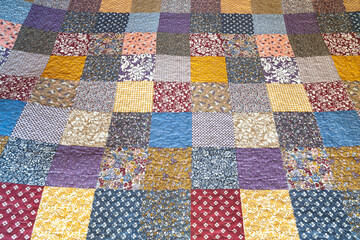 Print in patchwork style. Patchwork print quilt. Geometric pattern. Selective focus