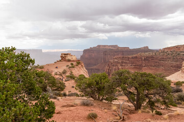 Fototapeta na wymiar Panoramic aerial view on Colorado River canyon seen from Saffer Canyon Overlook near Moab, Island in the Sky District, Canyonlands National Park, San Juan County, Utah, USA. Clouds and sky in summer