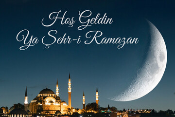 Ramadan Kareem or Hos Geldin Ramazan. Suleymaniye Mosque and crescent moon