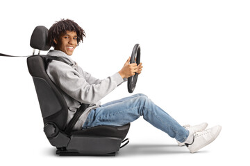 African american young man sitting in a car seat and holding a steering wheel