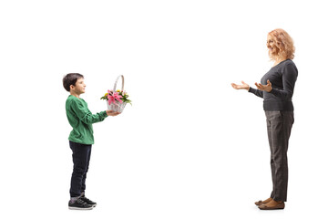 Boy giving flowers to a woman