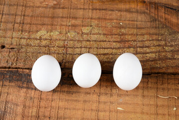 natural chicken egg white on the wooden table, rustic free-range chicken natural farm food