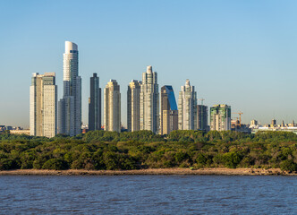 Large modern apartment buildings of Puerto Madero by the shoreline in Buenos Aires Argentina