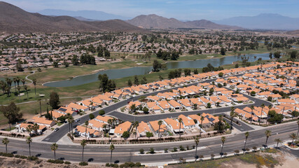 Aerial view of a sprawling neighborhood of family homes in Menifee, California, USA.