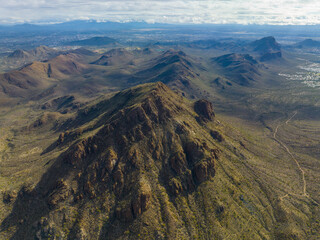 Bren peak and Ringtail Ridge in Tucson Mountains aerial view with Sonoran Desert landscape from Gates Pass near Saguaro National Park in city of Tucson, Arizona AZ, USA. 
