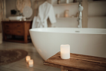 Soft native hues organic shapes look of bathroom with big window oval bathtub in neutrals tones....