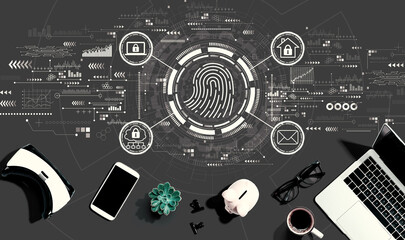 Fingerprint scanning theme with electronic gadgets and office supplies - flat lay